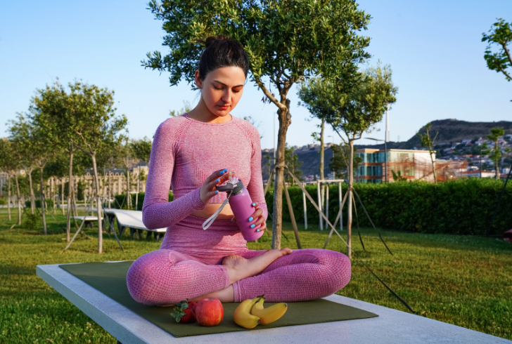 Woman yoga mat with fruits