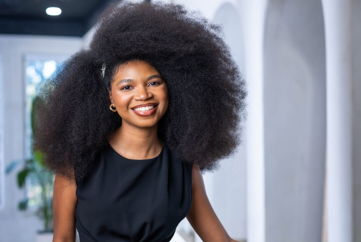 Jessica Martinez with large natural curly afro